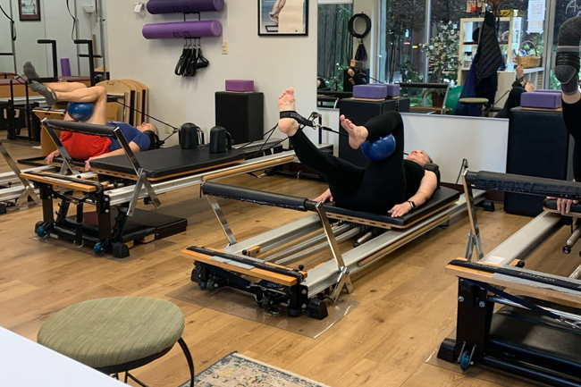 Pilates reformer for core strength