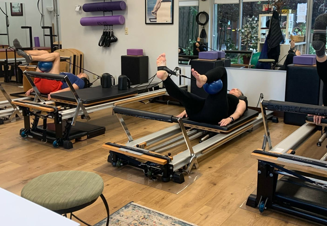 Pilates reformer for core strength